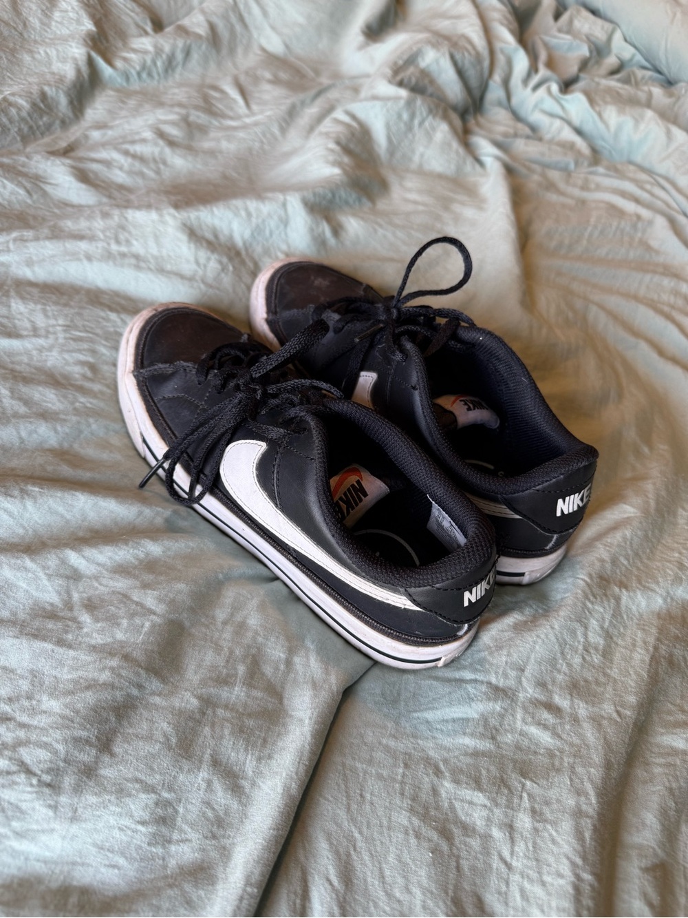 Nike Kids Black and White Low-Top Sneakers with Classic Swoosh
